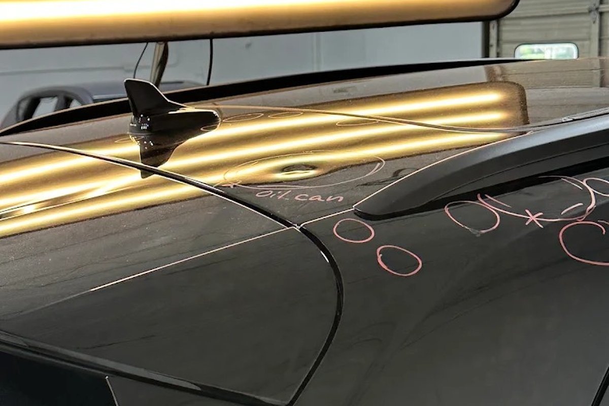 Paintless dent repair on a hail-damaged panel